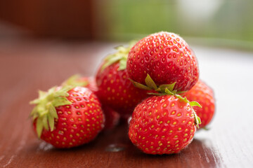 bunch of ripe strawberries lying on the table, a summer berry, a strawberry harvest, a beautiful summer picture