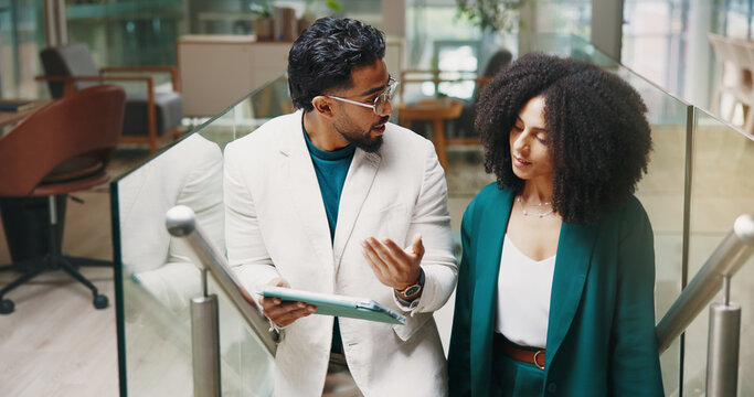 Talk, stairs or business people with tablet for feedback, investment research and budget. Collaboration, walk and financial advisors in office lobby for news, accounting advice and finance report - Powered by Adobe