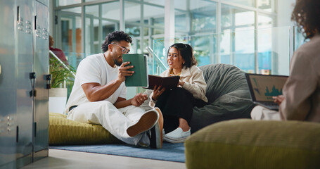 People, students and reading on tablet at college for research, exam preparation and studying. Man,...