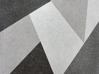Close up of modern abstract geometric pattern in white, grey, and black color. Monochrome colors...