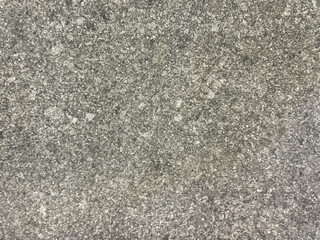 Close up of natural grey stone texture with black and white dots pattern, rough surfaces. Seamless background.