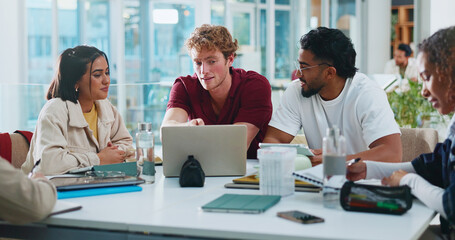 Students, university or study group with laptop in cafeteria for learning, education or course help. College, people and tech on campus for essay research, literature review and assignment discussion