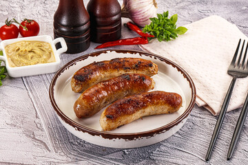 Delicous natural roasted sausages in the plate