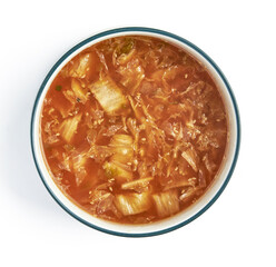 Bowl of traditional Korean kimchi soup with vibrant red broth, featuring napa cabbage, shredded...