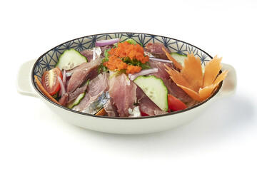 Bowl of fresh sashimi salad featuring thinly sliced raw fish, cucumber, red onion, and tomato, garnished with fish roe and shredded vegetables, served in decorative dish