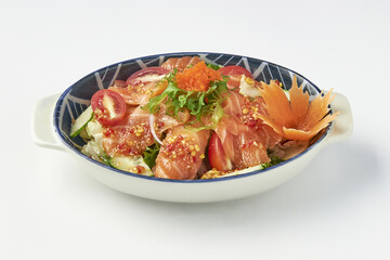 Bowl of fresh salmon salad with vibrant vegetables including cherry tomatoes cucumber and lettuce garnished with fish roe sesame seeds and decorative carrot flower served in ceramic dish