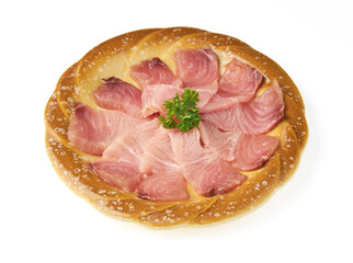 Round bread topped with thinly sliced raw fish, arranged in circular pattern, garnished with fresh parsley in center, creating unique fusion of bread and sashimi