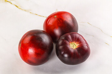 Black ripe juicy organic tomato