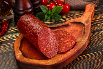 Spicy pepperoni sausages with sliced piece