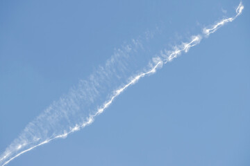 airplane trail in a blue sky