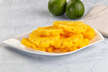 Sweet canned pineapple slices in syrope