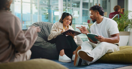 People, students and talk with tablet at college for research, exam preparation and studying. Man,...
