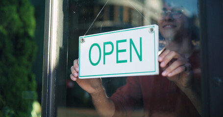 Happy person, hands and window with open sign in cafe for startup or ready for business....
