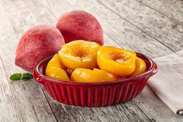Sweet ripe yellow canned peaches