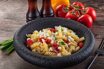 Italian pasta fusili with curd