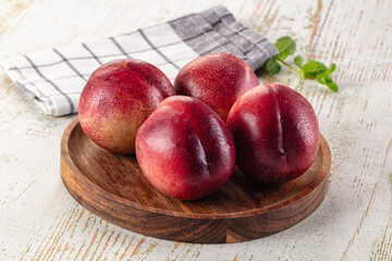 Ripe sweet juicy nectarines heap