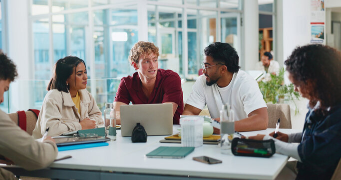 Students, discussion or study group with laptop in cafeteria for learning, education or course help. College, people and tech on campus for thesis research, literature review and brainstorming essay