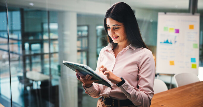 Smile, business woman and tablet in office for investment analysis or research. Technology, reading and worker with email for financial forecast, review and approval for project with risk assessment