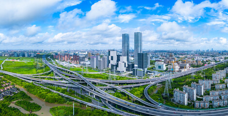 Panoramic aerial view of Shanghai Zhangjiang Hi Tech Development Zone, with heavy traffic overpass.
