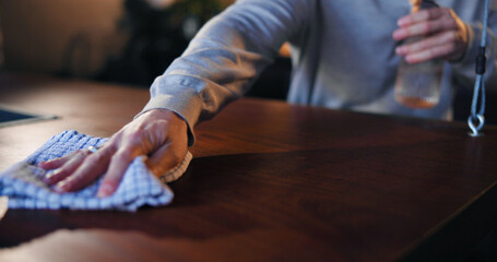 Cleaning, waiter and hands with spray, bar and chemical for hygiene, routine and sanitary for germs. Small business, disinfection and person with liquid for dirt, bacteria and maintenance at night