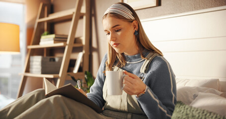 Writing, notebook and coffee with student in bedroom for study assignment due date and course. University reminder, GPA progress and academic calendar with woman and tea in home with journal