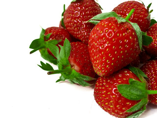 Fresh red strawberries isolated on a white background.