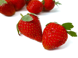 Fresh red strawberries isolated on a white background.