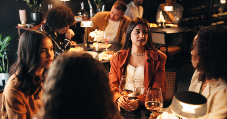 Relax, wine and talking with friends in restaurant for discussion, reunion and conversation. Fine dining, culture and gossip chat with women and drink for weekend, nightlife and social event