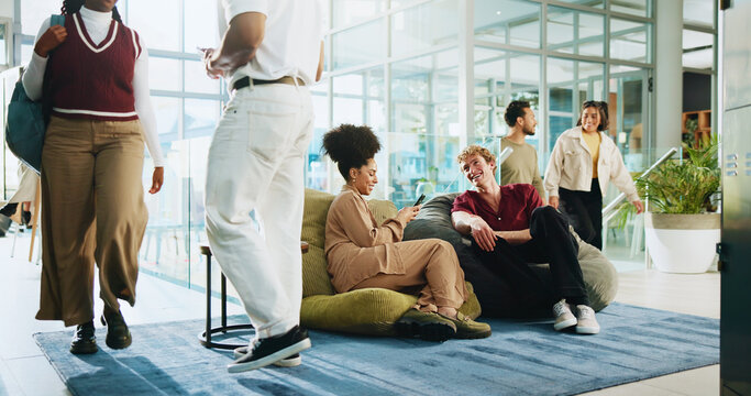 People, students and friends with phone for university, schedule and chat on lobby beanbag. Man, woman and talk with mobile app, relax and social media post for college announcement or learning