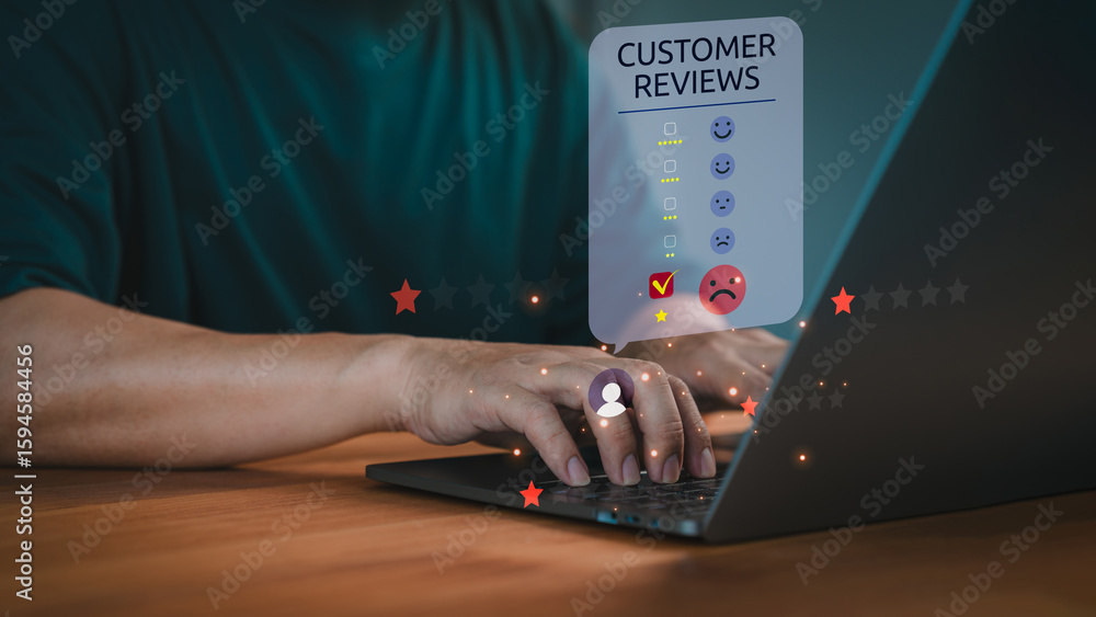 Poster hand typing on laptop with a customer review panel display rating icon and a negative feedback emoji