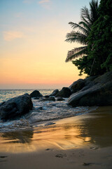 waves on an evening beach in the tropics