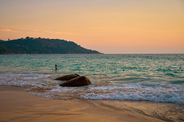 waves on an evening beach in the tropics