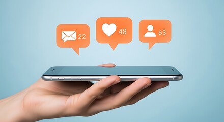 A hand holding a smartphone with social media notification icons floating above.