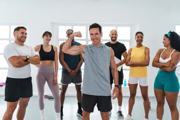 Multiethnic group of sportive people doing functional workout at the gym, concepts about sport and...