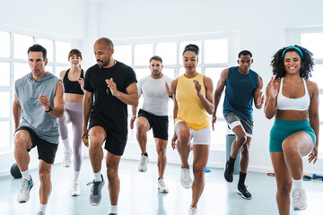Multiethnic group of sportive people doing functional workout at the gym, concepts about sport and...