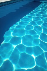 Deep blue swimming pool showing extensive surface damage and water ripples, extensive, worn, imperfection
