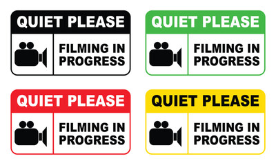Four Colorful Signs Indicating Filming in Progress and Requesting Quiet on Set The image
