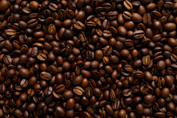Aromatic roasted coffee beans create a rich, textured background for coffee lovers