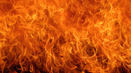 Intense orange and yellow flames create a mesmerizing and fiery inferno