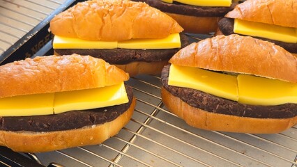 Soft sweet buns filled with rich red bean paste and thick slices of butter, freshly baked and...