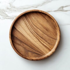 Empty round wooden platter on marble