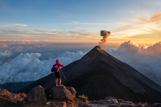 One person looking Volc&aacute;n de Fuego eruption at sunset