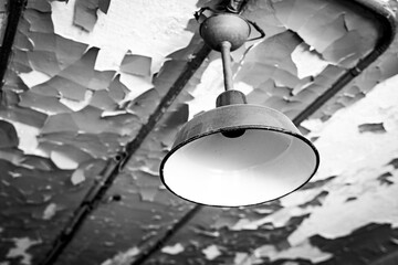 Abandoned Industrial Lights on Peeling Walls