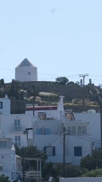 famous windmills of Mykonos island over seascape, Mykonos island, Greece. High quality 4k footage