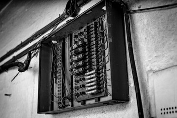 Vintage Electrical Fuse Box with Exposed Wiring