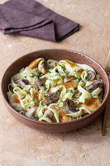 Fettuccine pasta with chicken and mushrooms in creamy sauce. Italian cuisine. Recipe.