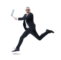 A businessman holding a laptop jumps joyfully, shouting in celebration of his success, isolated on...