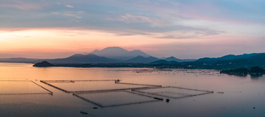 Scenic Panorama Drone Picture of Laguna de Bay with Mount Banahaw in the background during misty...