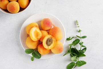 Ripe Apricots on white background. Sliced apricot, copy space, top view