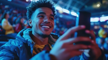 Obraz premium Young Man Smiling with Joy and Excitement in a Crowded Arena